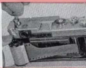 Close-up of a mechanical assembly with a tool interacting with a component (no visible text or symbols).