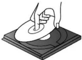Illustration of hands using a tool to print or spread a circular object on a dark base (no text or symbols).