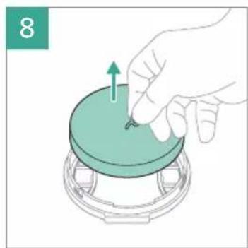 Illustration of a hand pressing down on a circular component with an arrow indicating upward motion (no text or symbols)