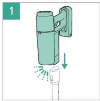 Illustration of a green cylindrical device with a vertical panel and a downward arrow indicating motion or force (no text or symbols)