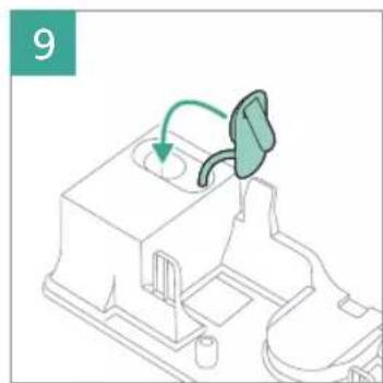 Diagram of a mechanical device with a green arrow indicating a process or operation, no visible text or symbols