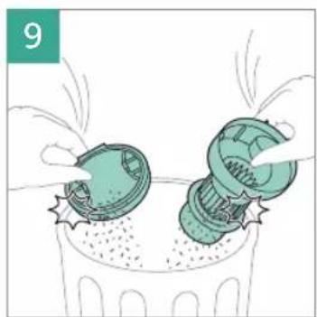 Illustration of two green mechanical components pouring liquid into a trash bin (no text or symbols)