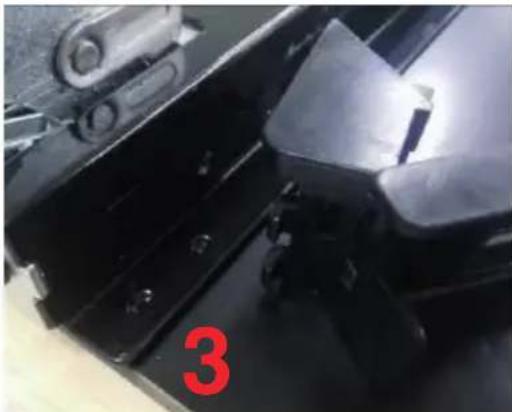 Close-up of mechanical components with a red number '3' overlaid. No readable text or symbols.