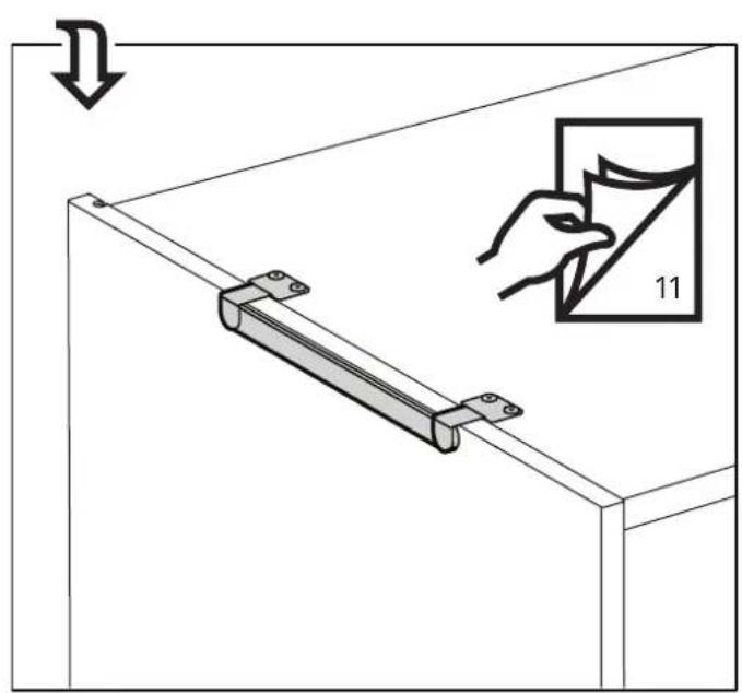Diagram showing a hand holding a small object labeled '11' next to a metal bracket, with an arrow indicating direction.