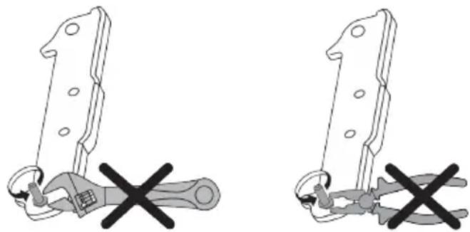 Two identical line drawings of a mechanical clamp or bracket with a central tool and cross marks, no text or symbols present.