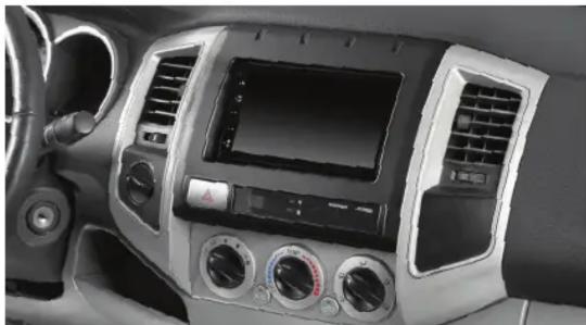 Interior view of a car dashboard with air filters and a digital display (no visible text or symbols)