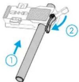 Diagram showing a mechanical device with labeled parts and directional arrows indicating motion or assembly.