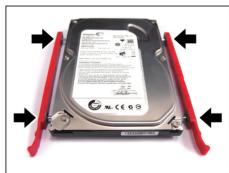 Close-up of a hard disk drive with red clamps and black arrows indicating fasteners (no visible text or symbols)