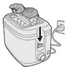 Line drawing of a toaster with two food items and a handle, showing a drop in the air (no text or symbols)