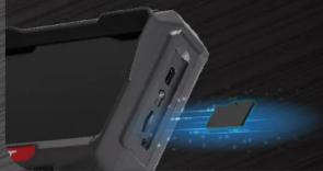 Gros plan d'un appareil électronique portable avec des ports éclairés et un effet de lumière bleue (aucun texte ni symbole visible).