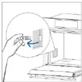 Hand holding a small object with an arrow pointing to a rectangular object inside a circular frame.
