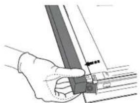 Hand holding a mechanical component with a ruler and guide rod.