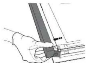 Hand holding a metal bracket with a small inset view showing a pin (no text or symbols visible).