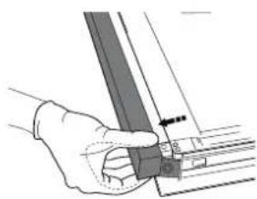 Hand holding a mechanical component with a tool.