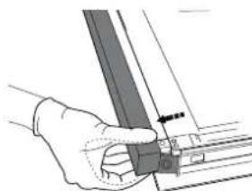 Hand holding a metal bracket with a small inset view (no text or symbols visible).
