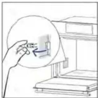 Hand holding a magnified circular object with an arrow, next to a printer (no text or symbols visible)