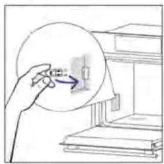 Hand holding a circular diagram with arrows pointing to a small electrical component (no text or symbols visible)