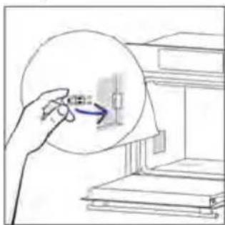 Diagram showing a hand holding a circular object with an arrow pointing to a vertical line inside, next to stacked books or documents.