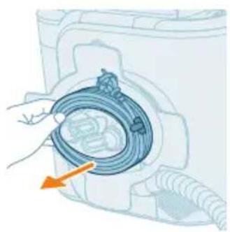 Illustration of a hand holding a blue cable inside a washing machine (no text or symbols visible)