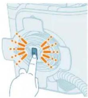 Illustration of a hand pointing at a button with orange dots around it, next to a washing machine (no text or symbols)