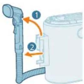 Diagram showing a hair dryer with labeled parts and directional arrows indicating motion or assembly.