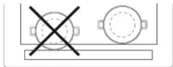 Simple line drawing of a table with two circular objects and a cross symbol (no text or labels)