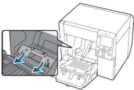 Diagram showing a printer internal structure with arrows indicating loading or movement, no text or symbols present.