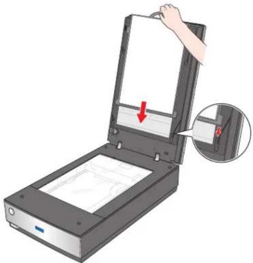 Illustration of a handheld scanner with a hand adjusting its cover, showing internal components and a red arrow indicating a location (no text or symbols present)