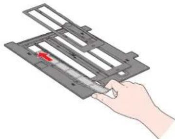 Hand holding a mechanical device with a red arrow pointing to a component (no text or symbols visible).