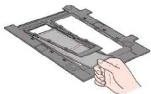 Illustration of a hand inserting a component into a device frame (no text or symbols)