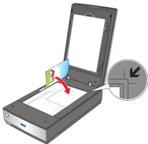 Illustration of a scanner with a green card being inserted, showing a red arrow indicating the process (no text or symbols present).