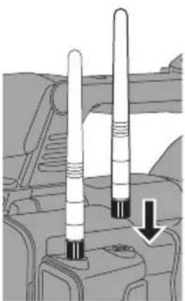 Diagram of two vertical cylindrical components mounted on a vehicle chassis, with one component highlighted by a downward arrow (no text or symbols present)