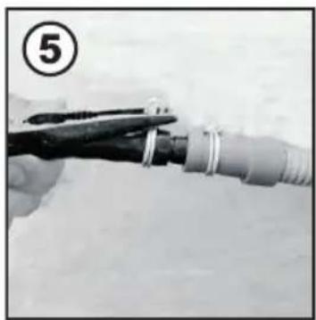 Close-up of a hand holding a tool with a coiled cable, no visible text or symbols