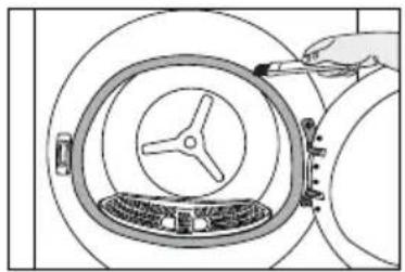 Diagram of a hand inserting a component into a circular device with a central knob (no text or symbols).