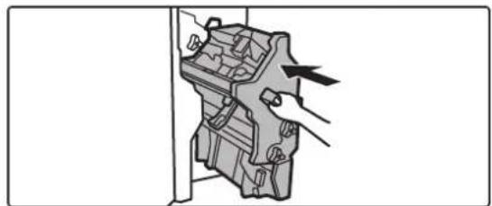 Diagram of a hand inserting a component into a mechanical housing (no text or symbols visible)