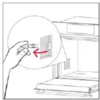 Illustration of a hand holding a small electronic component with an arrow pointing to it, next to an open storage unit.