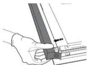 Hand holding a metal bracket with a pointer and mounting bracket.