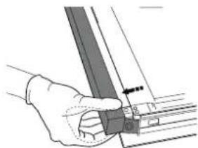Hand holding a metal bracket with a pointer and measurement markings, no visible text or symbols.
