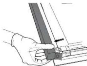 Hand holding a metal bracket with a small inset view of a mechanical part.