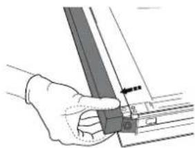 Hand holding a metal bracket with a small arrow pointing to it (no text or symbols visible).
