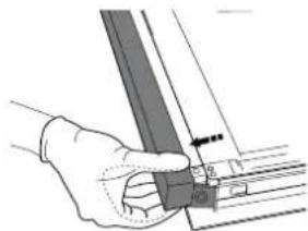 Hand holding a metal bracket with a ruler and guide pin (no text or symbols visible)