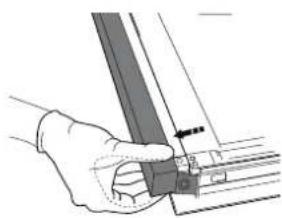 Hand holding a mechanical component with a tool, no visible text or symbols.