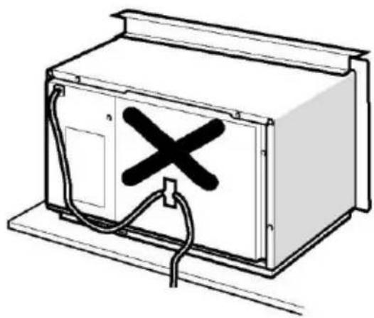 Line drawing of a cabinet with an X-shaped mark on the door, connected to wires (no text or symbols)