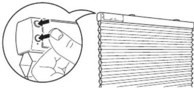 Diagram showing a hand inserting a component into a cylindrical device, with no visible text or symbols.