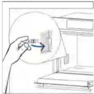 Hand holding a magnifying glass over a small electronic component, no text or symbols visible
