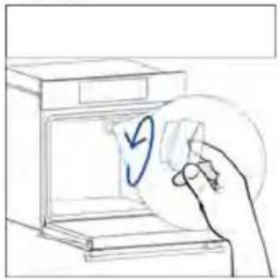Hand placing a paper with a blue checkmark inside an open kitchen appliance (no text or symbols)