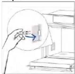 Hand holding a small object with an arrow pointing to it, next to a bookshelf (no text or symbols visible)
