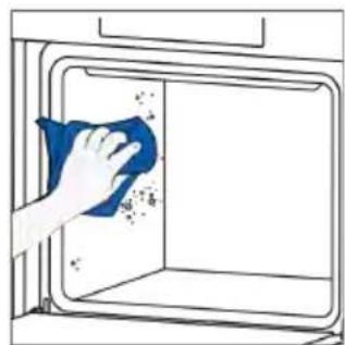 Hand cleaning a kitchen appliance with a blue cloth (no text or symbols visible).