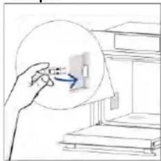 Hand holding a small object with an arrow pointing to it, next to a bookshelf (no text or symbols visible)