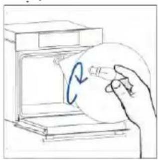 Hand holding a circular object inside a device, with a blue curved arrow indicating rotation (no text or symbols).